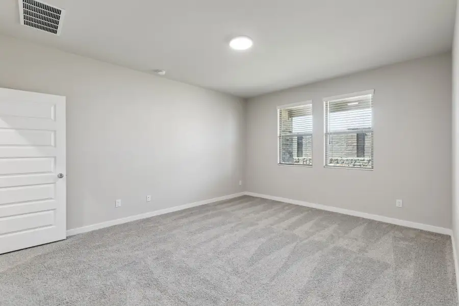 Primary Suite in the Holden home plan by Trophy Signature Homes – REPRESENTATIVE PHOTO