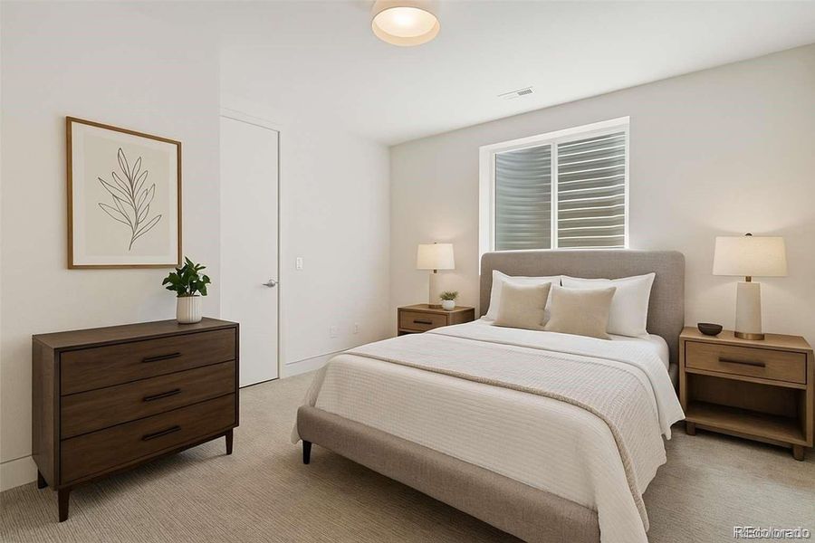 Lower level bedroom has custom closet and lighted window wells!