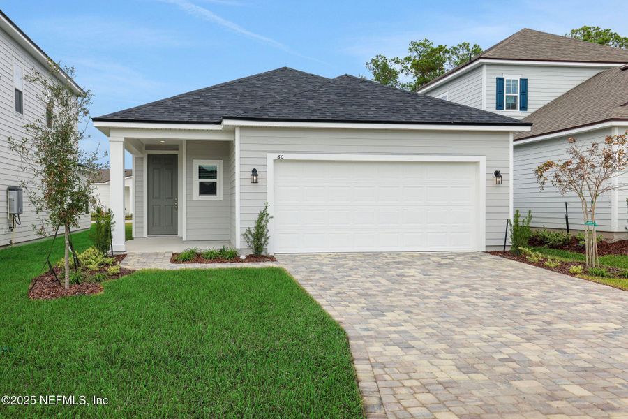 Front exterior of a new home in Brook Forest, St. Augustine, FL, highlighting curb appeal (Image 21).