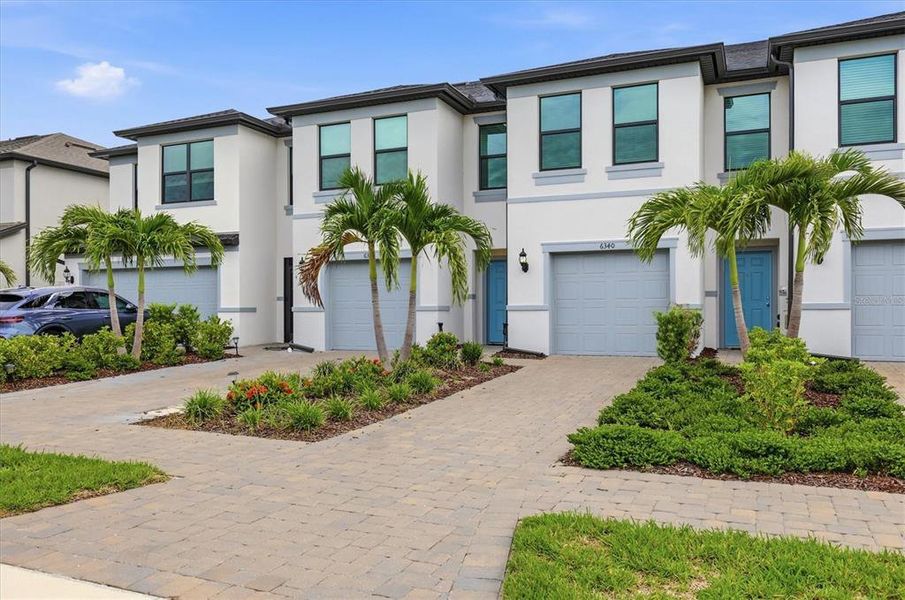 Front exterior of a new home in , Sarasota, FL, highlighting curb appeal (Image 1). Front exterior of a new home in , Sarasota, FL, highlighting curb appeal (Image 1).