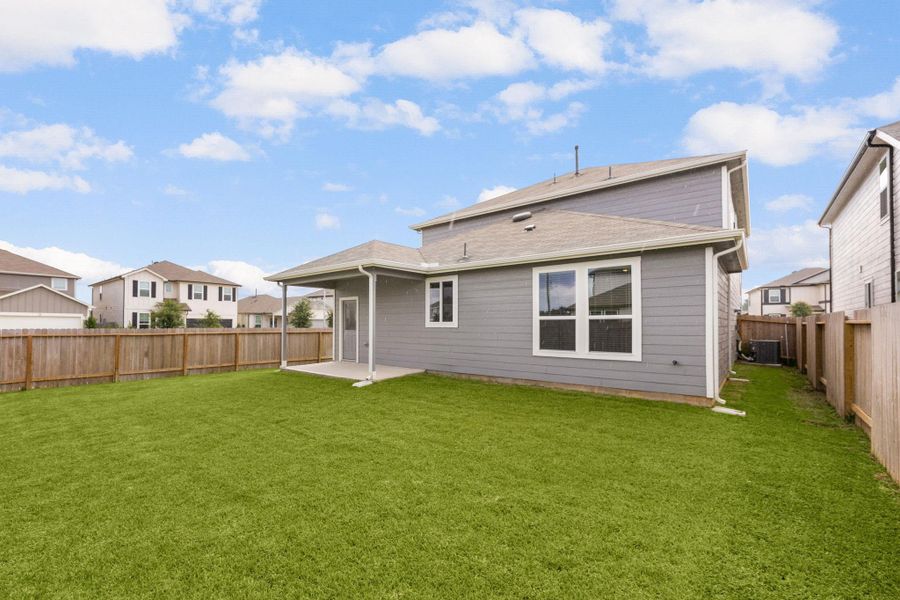 Enjoy a low-maintenance backyard with a covered patio and plenty of room to make it your own.