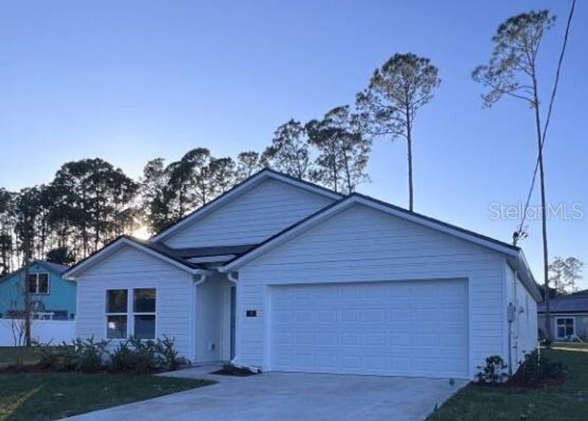 Front exterior of a new home in , Palm Coast, FL, highlighting curb appeal (Image 26).