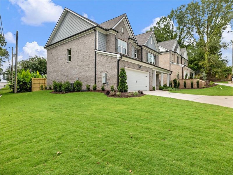 Front exterior of a new home in , Buford, GA, highlighting curb appeal (Image 21). Front exterior of a new home in , Buford, GA, highlighting curb appeal (Image 21).