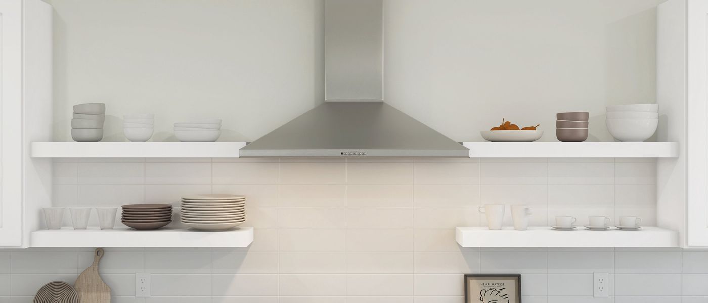 Kitchen with floating shelves and stainless steel hood