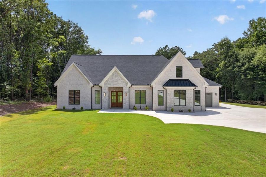 Front exterior of a new home in , Monroe, GA, highlighting curb appeal (Image 1). Front exterior of a new home in , Monroe, GA, highlighting curb appeal (Image 1).