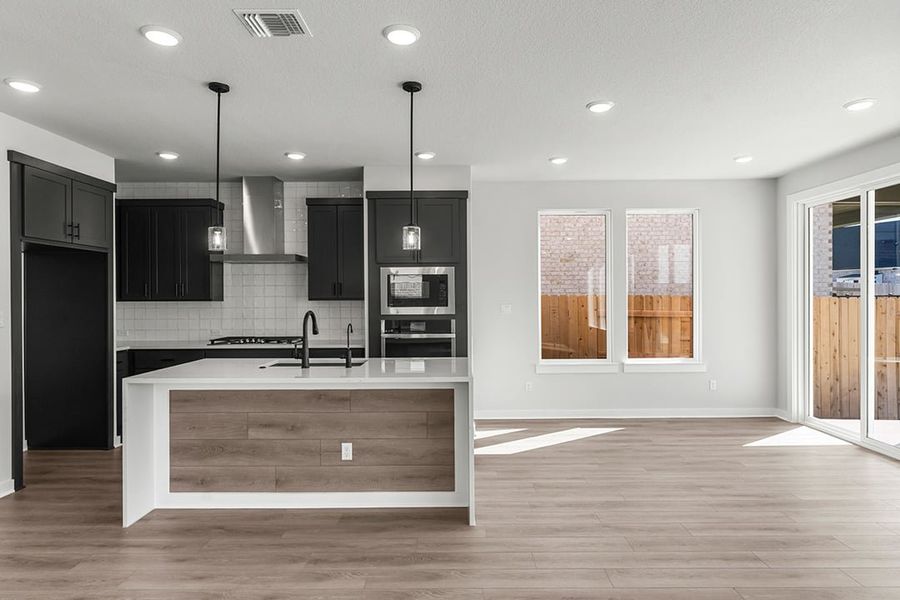 Furnished interior view inside a new home in Terrace Collection at Lariat, Liberty Hill (Image 11). Furnished interior view inside a new home in Terrace Collection at Lariat, Liberty Hill (Image 11).