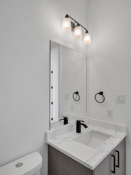 Bathroom featuring toilet and vanity