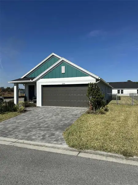 Front exterior of a new home in Cherrywood Preserve, Ocala, FL, highlighting curb appeal (Image 2).