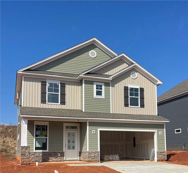 This new construction home features a harmonious b