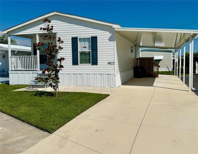 Front exterior of a new home in , Sarasota, FL, highlighting curb appeal (Image 24).
