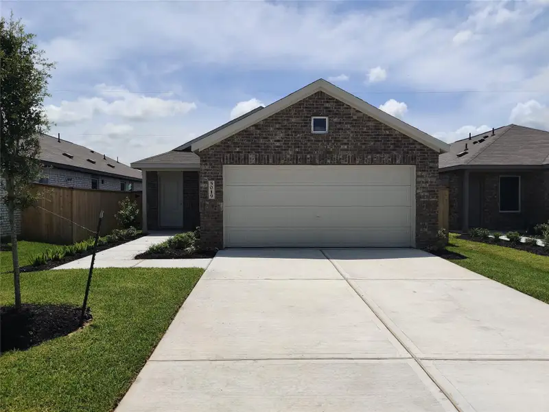 Front exterior of a new home in Monarch Landing, Needville, TX, highlighting curb appeal (Image 2). Front exterior of a new home in Monarch Landing, Needville, TX, highlighting curb appeal (Image 2).