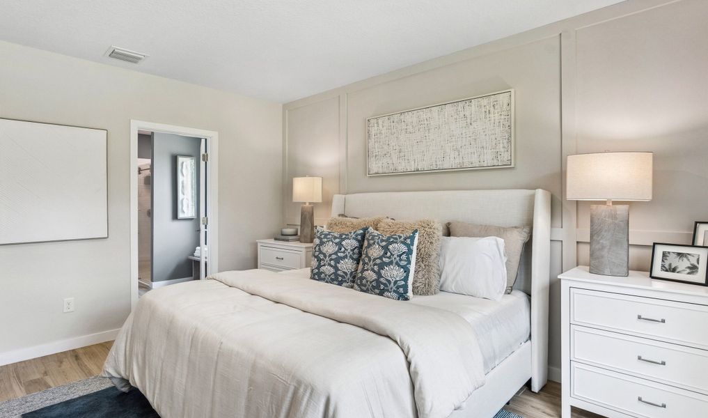 Primary suite with decorative feature wall