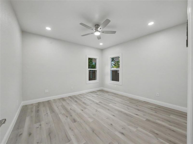 Neutral tone walls with wood-finish flooring