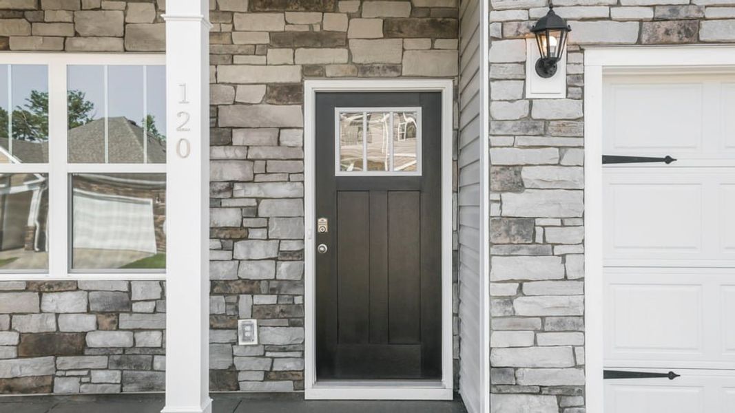 Exterior details and patio area of a home in Waverly Station, Greenwood (Image 3).