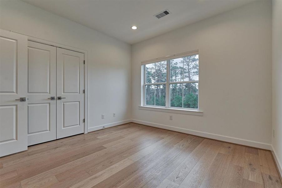 Secondary bedroom has generous sized closet with double doors!