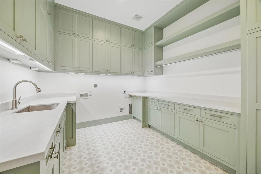 Large upstairs utility room with plenty of storage.