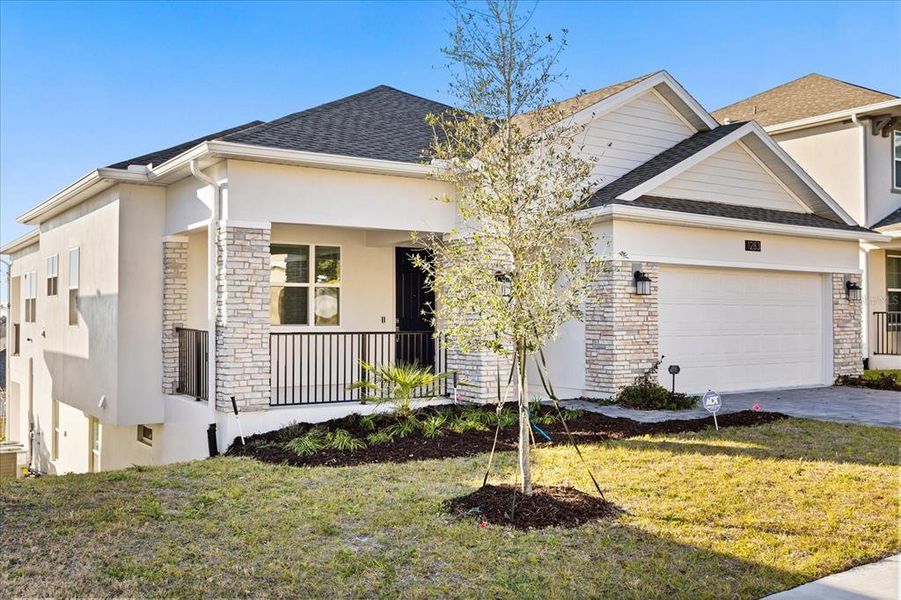 Front exterior of a new home in Dora Parc, Mount Dora, FL, highlighting curb appeal (Image 27).