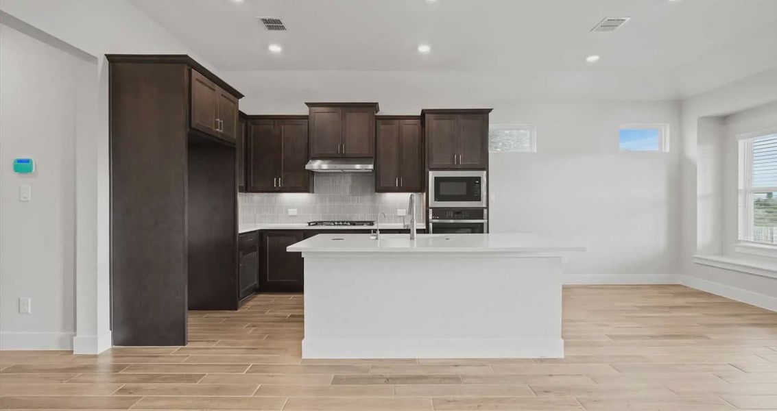 Representative furnished interior of a home built from the Aspen by Chesmar Homes in Village at Three Oaks, Seguin (Image 4).