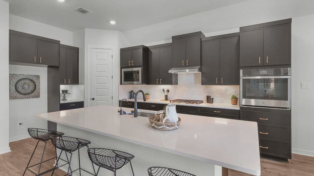 Representative furnished interior of a home built from the Brooks by Chesmar Homes in University Heights, Round Rock (Image 12).