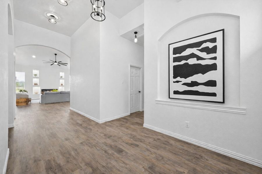 Welcoming entry leading into a bright, open-concept interior filled with natural light.