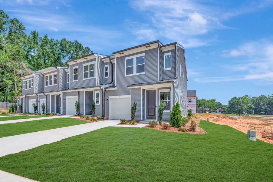 Front exterior of a new home in Amplitude, Charlotte, NC, highlighting curb appeal (Image 18). Front exterior of a new home in Amplitude, Charlotte, NC, highlighting curb appeal (Image 18).