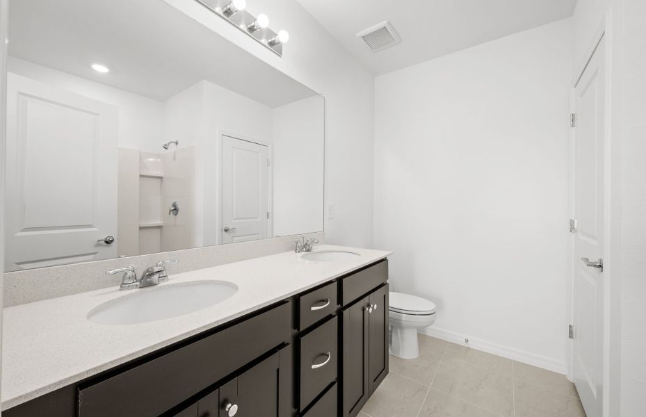 Furnished interior view inside a new home in Whispering Lakes, Lehigh Acres (Image 15).