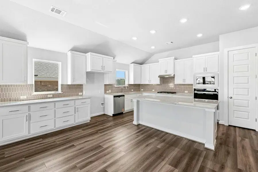 Furnished interior view inside a new home in The Colony, Bastrop (Image 7). Furnished interior view inside a new home in The Colony, Bastrop (Image 7).