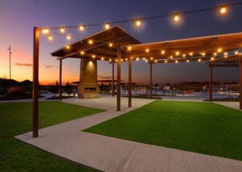 View of property's community with a patio and a lawn