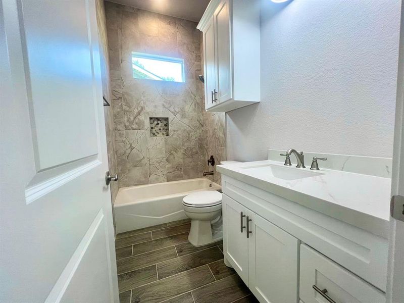 Guest bathroom with custom tile work