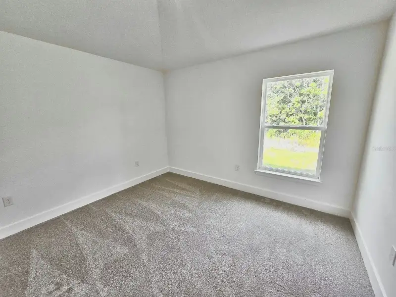 Spacious, unfurnished interior of a new home in Harmony Central, St. Cloud (Image 15).