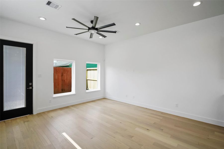 Abundant natural light illuminates this spacious, open-plan area through expansive windows. Abundant natural light illuminates this spacious, open-plan area through expansive windows.