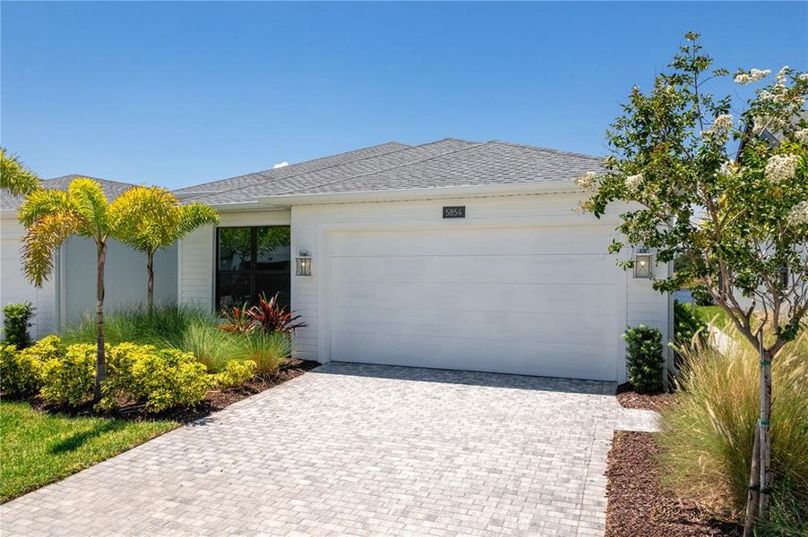 Front exterior of a new home in , Apollo Beach, FL, highlighting curb appeal (Image 2). Front exterior of a new home in , Apollo Beach, FL, highlighting curb appeal (Image 2).