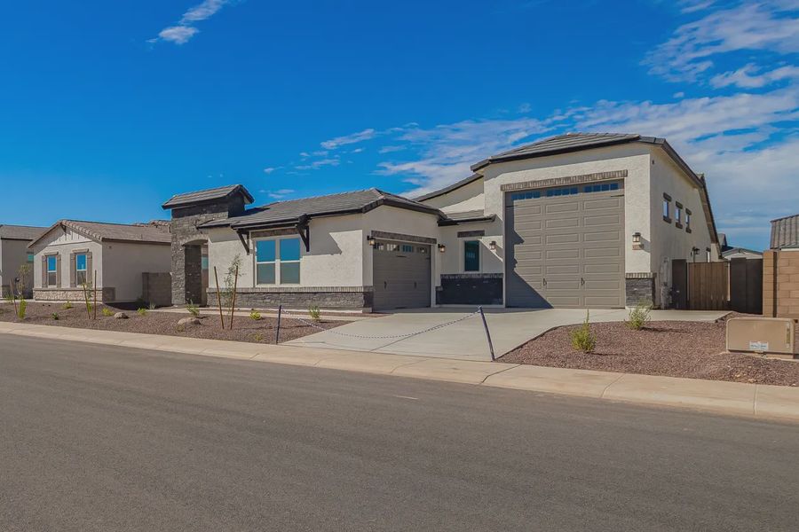 Front exterior of a new home in Valencia at Granite Vista, Waddell, AZ, highlighting curb appeal (Image 19).