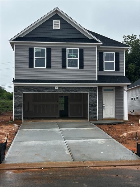 A newly constructed residence boasts an attached g