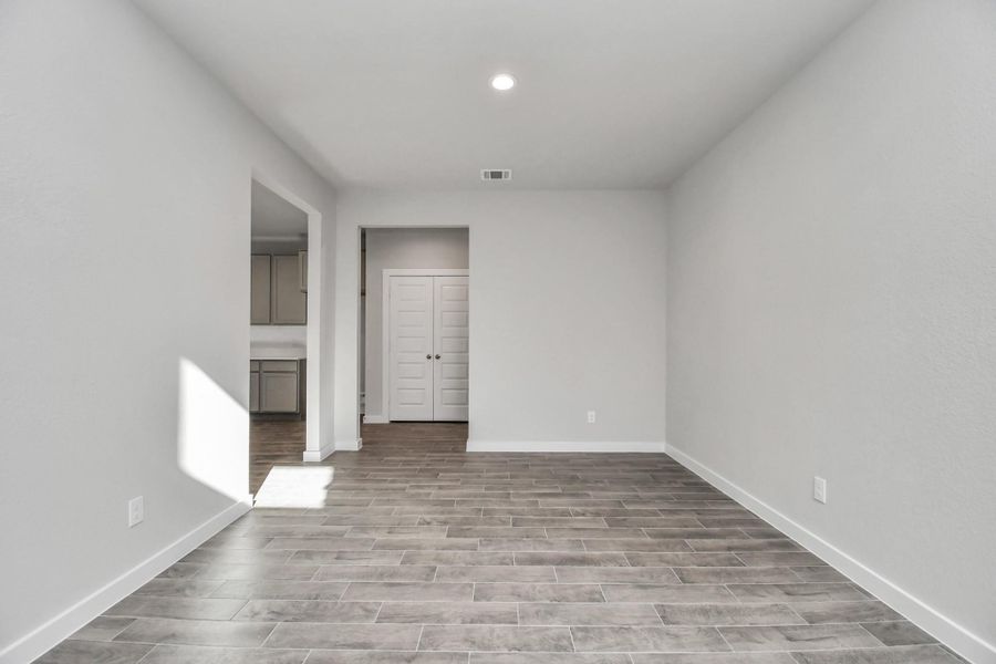 Make memories gathered around the table with your family and friends! This spacious dining room features elegant flooring, custom paint, and adjacent to family room and kitchen for open concept feel. Sample photo of completed home with similar floor plan. Actual colors and selections may vary. Make memories gathered around the table with your family and friends! This spacious dining room features elegant flooring, custom paint, and adjacent to family room and kitchen for open concept feel. Sample photo of completed home with similar floor plan. Actual colors and selections may vary.