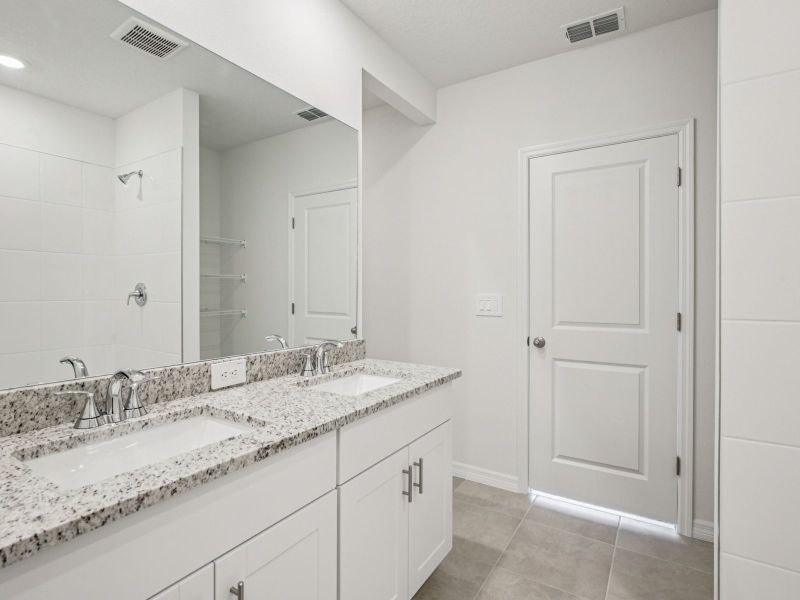 Furnished interior view inside a new home in The Grove at Stuart Crossing - Premier Series, Bartow (Image 6).