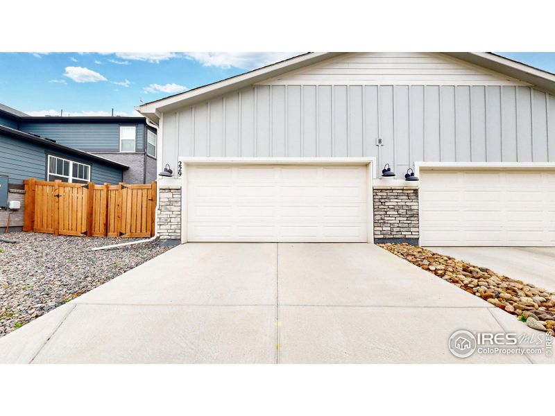 Front exterior of a new home in Fickel Farms, Berthoud, CO, highlighting curb appeal (Image 16).