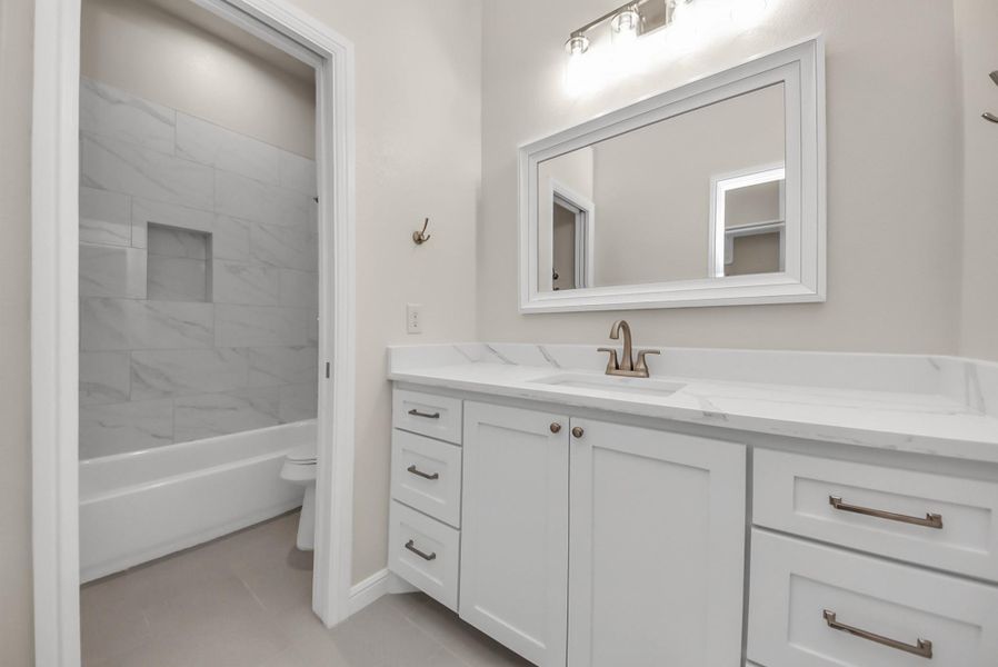 This en-suite bathroom is attached to the third bedroom.