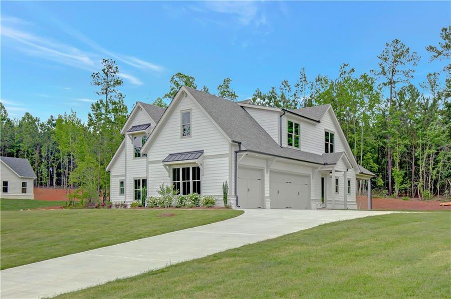 Front exterior of a new home in , Newnan, GA, highlighting curb appeal (Image 1). Front exterior of a new home in , Newnan, GA, highlighting curb appeal (Image 1).