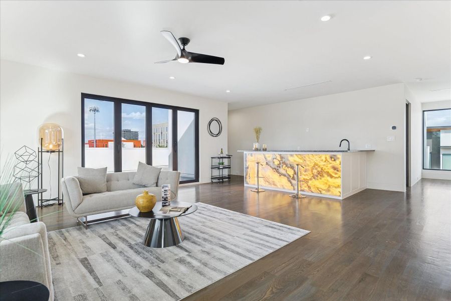 Expansive third-floor game room with sleek design and abundant natural light