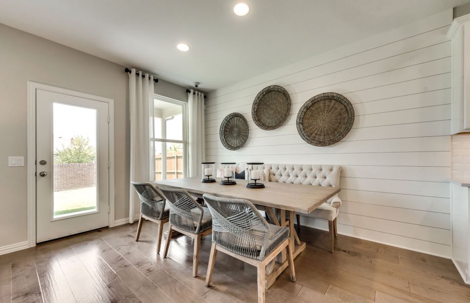 Dining nook off kitchen with access to backyard