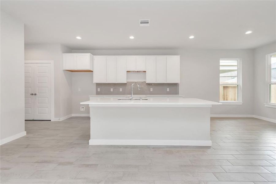 This generously spacious kitchen is a dream realized! Sample photo of completed home with similar floor plan. As-built interior colors and selections may vary