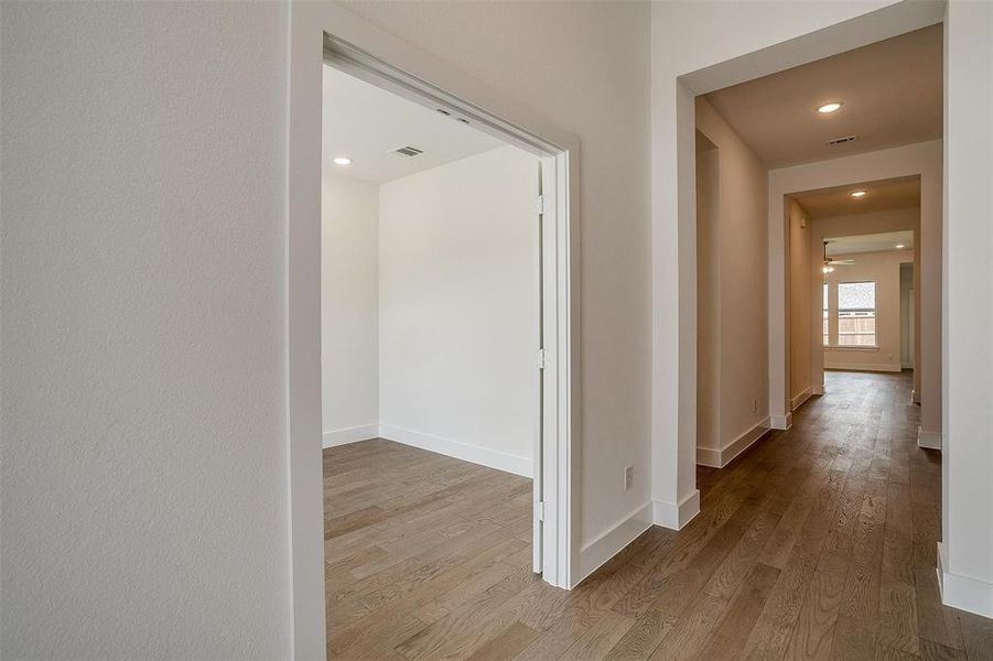 Hall with wood-type flooring