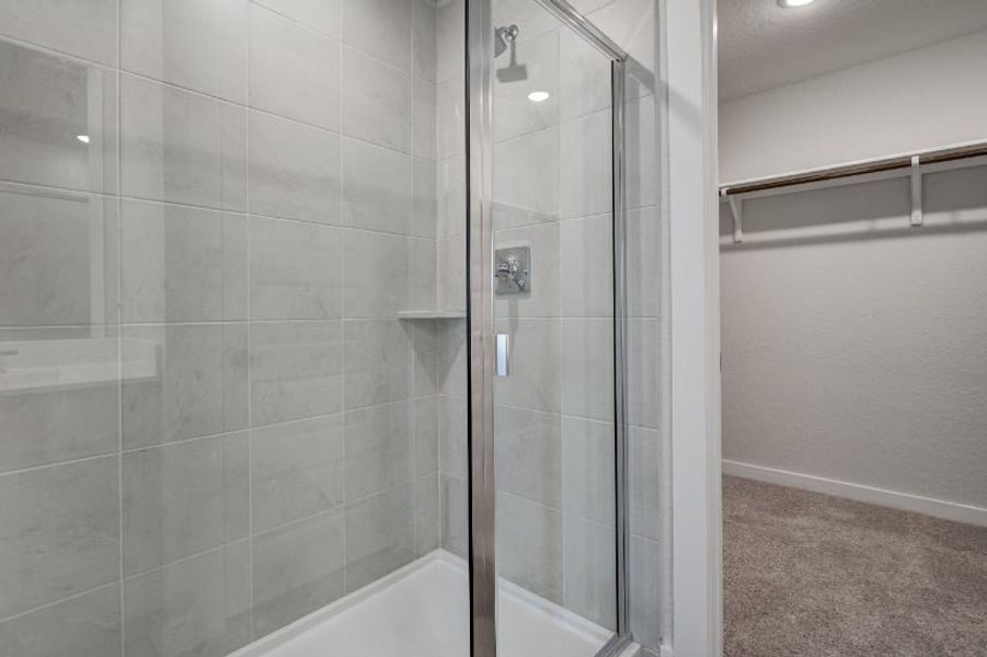 A shower with a glass door. A shower with a glass door.