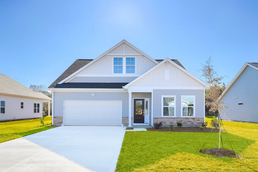 Front exterior of a new home in Garden Grove, Conway, SC, highlighting curb appeal (Image 1). Front exterior of a new home in Garden Grove, Conway, SC, highlighting curb appeal (Image 1).