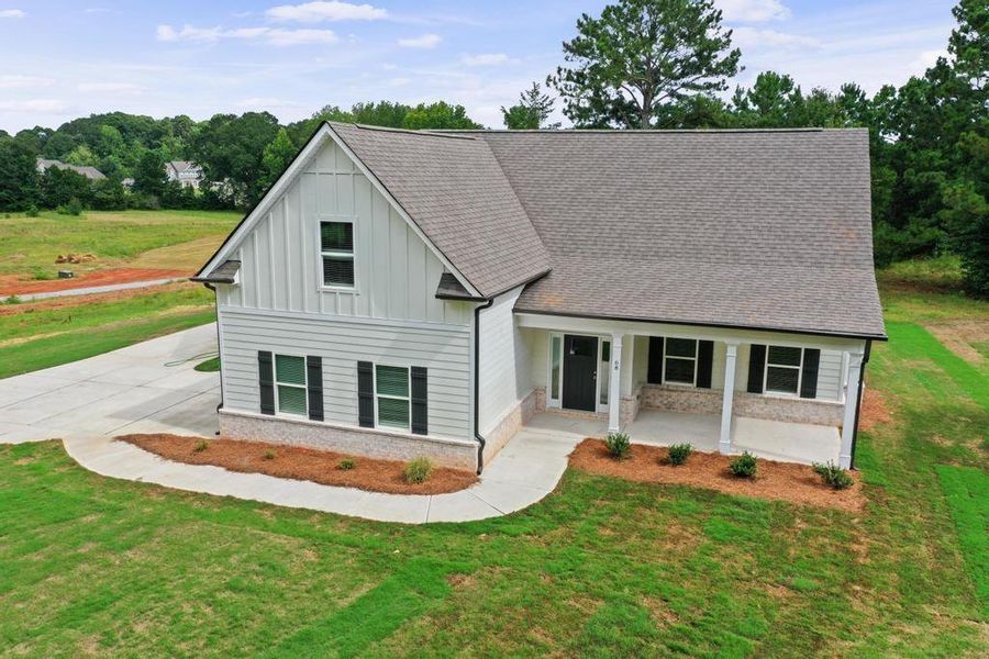 Front exterior of a new home in , McDonough, GA, highlighting curb appeal (Image 17). Front exterior of a new home in , McDonough, GA, highlighting curb appeal (Image 17).