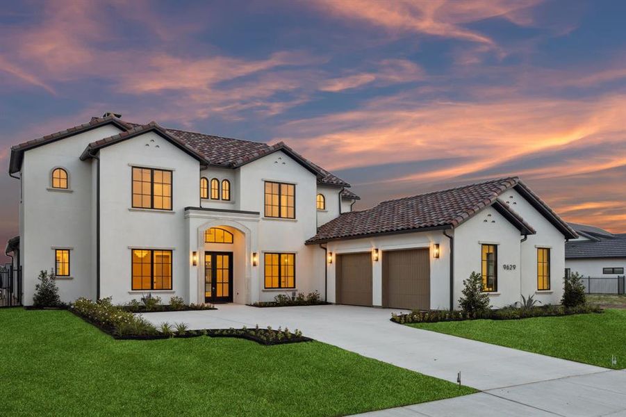 Mediterranean / spanish-style house featuring driveway, an attached garage, stucco siding, and a tile roof Mediterranean / spanish-style house featuring driveway, an attached garage, stucco siding, and a tile roof