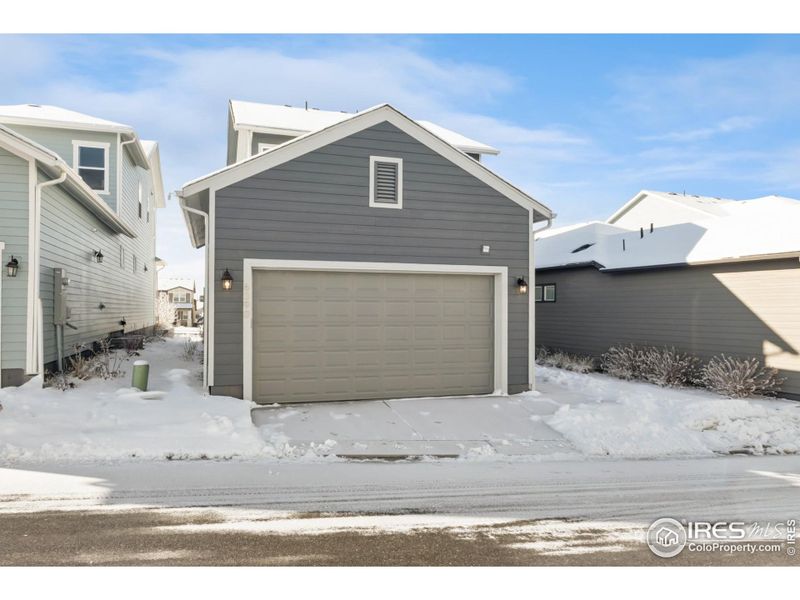 Front exterior of a new home in Kinston Cottage, Loveland, CO, highlighting curb appeal (Image 21). Front exterior of a new home in Kinston Cottage, Loveland, CO, highlighting curb appeal (Image 21).