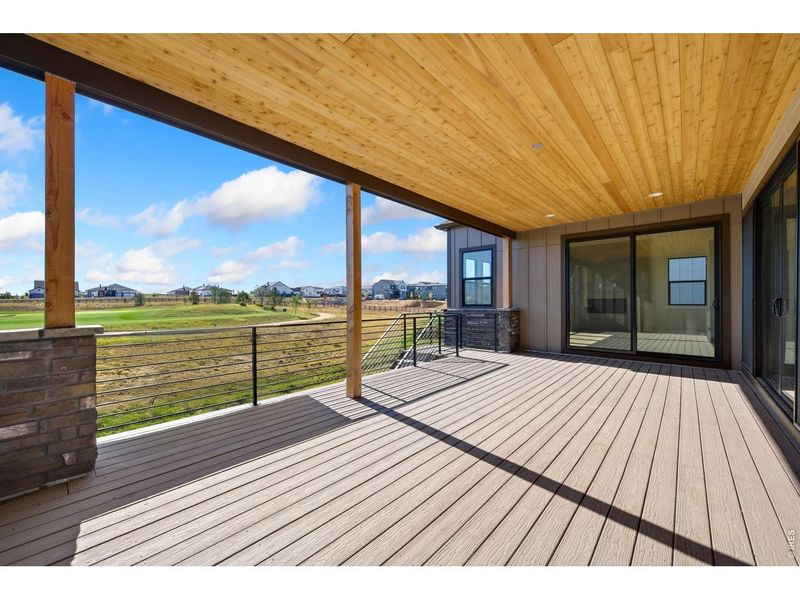 Exterior details and patio area of a home in The Fairways at RainDance, Windsor (Image 15).