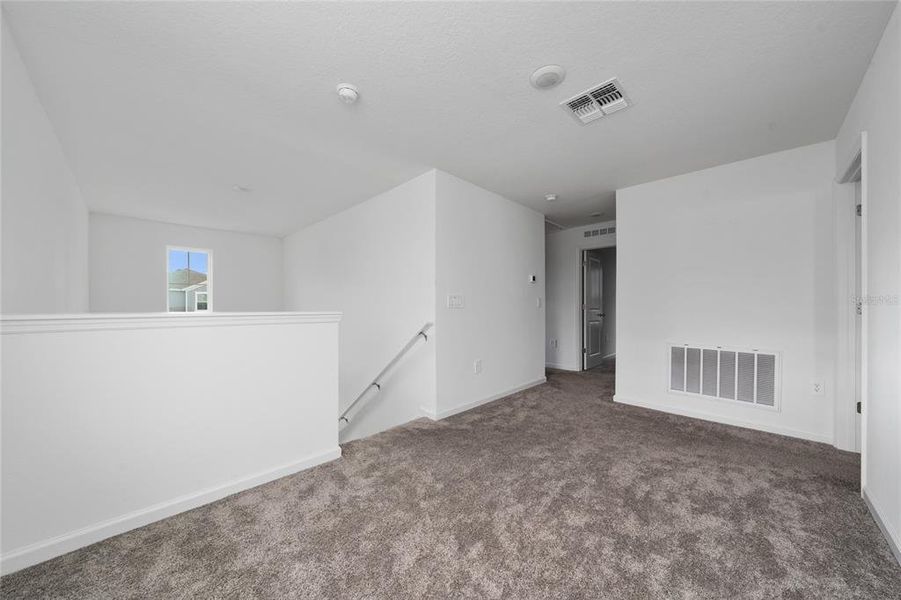 Spacious, unfurnished interior of a new home in Ranches at Lake Mcleod: Legacy Collection, Eagle Lake (Image 11).